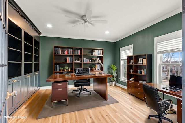 office with baseboards, ornamental molding, light wood-style flooring, and a ceiling fan