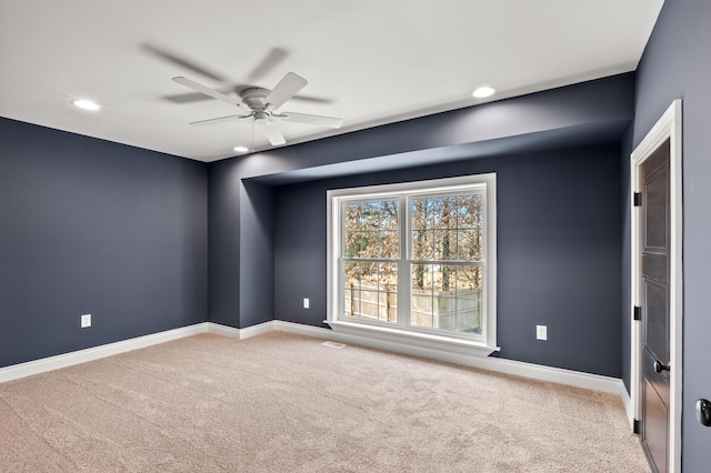 spare room featuring recessed lighting, carpet, a ceiling fan, and baseboards