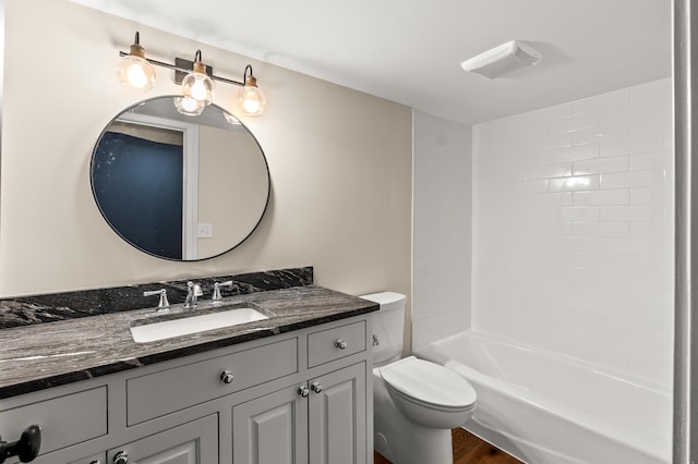 bathroom featuring shower / tub combination, vanity, and toilet