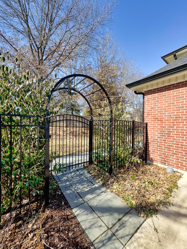 view of gate featuring fence