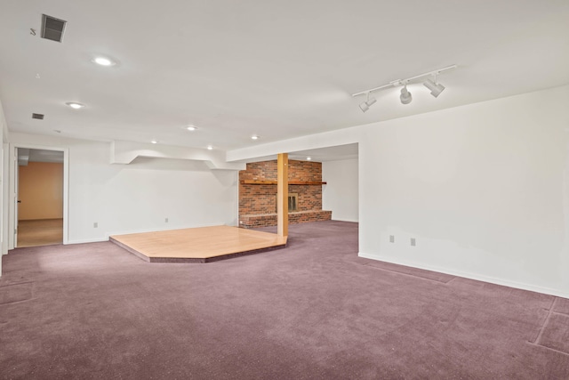 interior space with baseboards, visible vents, track lighting, and recessed lighting