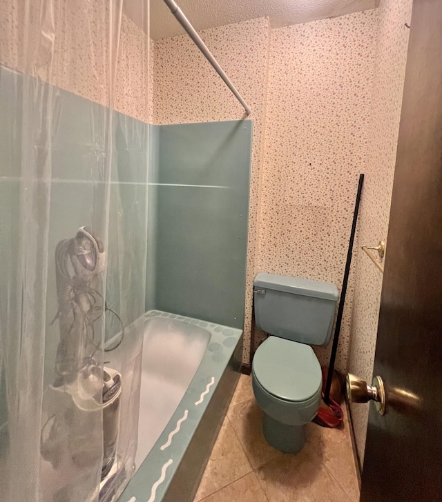 full bathroom with a shower, toilet, and tile patterned floors