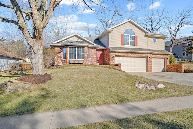 view of front of property with a garage, driveway, brick siding, and a front yard