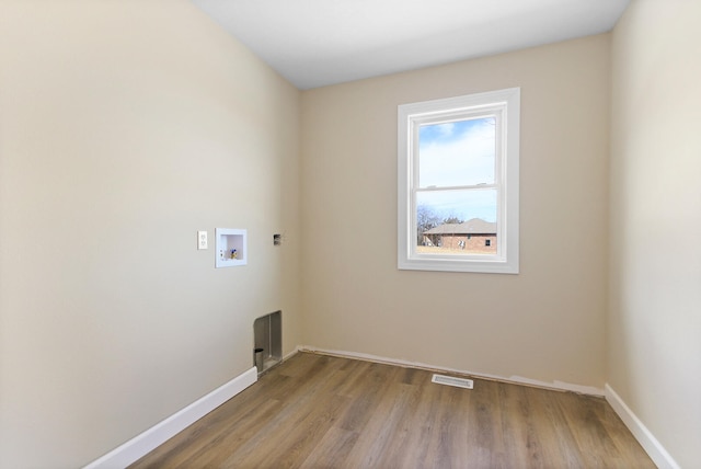 laundry room featuring washer hookup, laundry area, visible vents, and baseboards