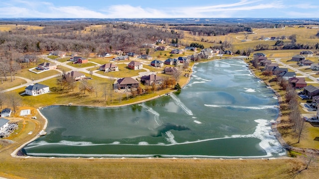 drone / aerial view with a water view and a residential view