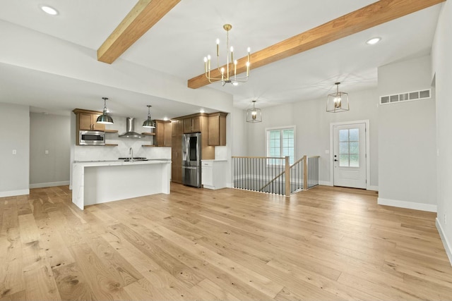 unfurnished living room featuring baseboards, visible vents, beamed ceiling, light wood-style floors, and a chandelier