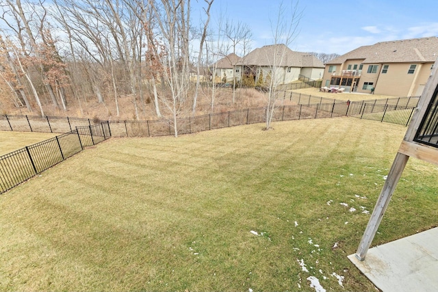 view of yard featuring a fenced backyard and a residential view