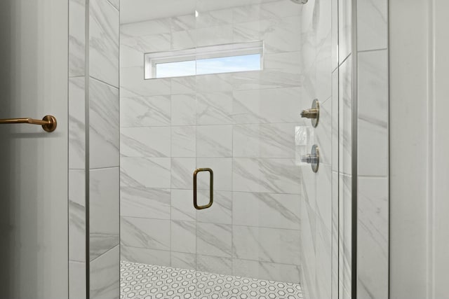 bathroom featuring a shower stall