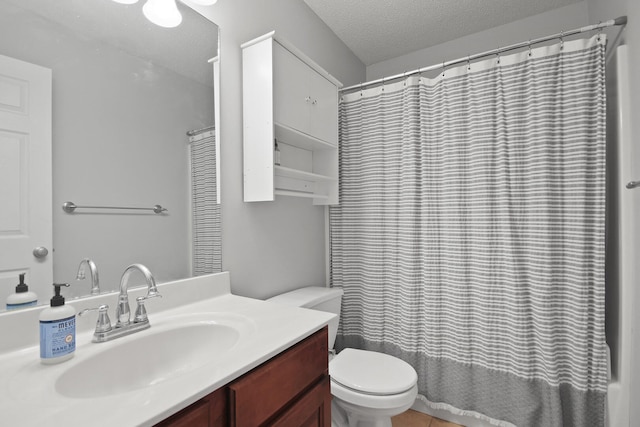 bathroom featuring a textured ceiling, shower / tub combo, vanity, and toilet