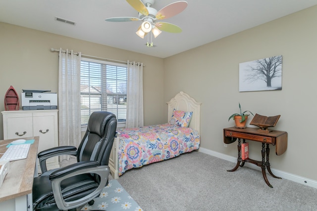 carpeted bedroom with visible vents, ceiling fan, and baseboards