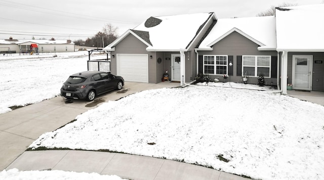 single story home with a garage and concrete driveway