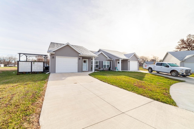 single story home with a front yard, concrete driveway, and an attached garage