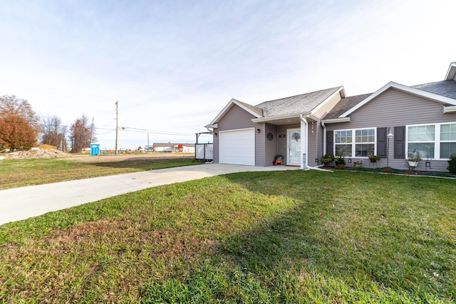 ranch-style home featuring a shingled roof, a front yard, driveway, and an attached garage