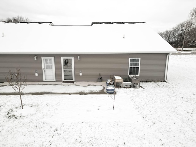 view of snow covered house