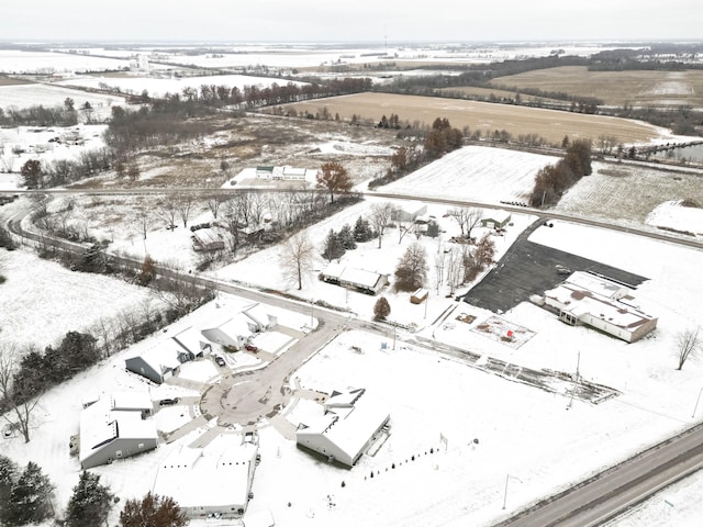 snowy aerial view featuring a rural view