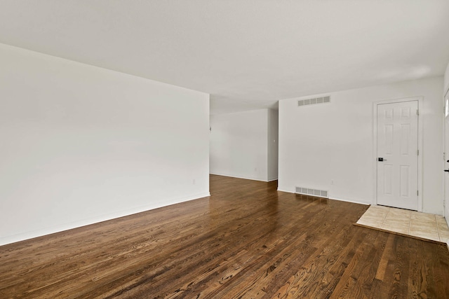 spare room with visible vents and wood finished floors