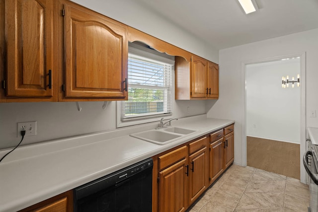 kitchen with black dishwasher, light countertops, a sink, and brown cabinets