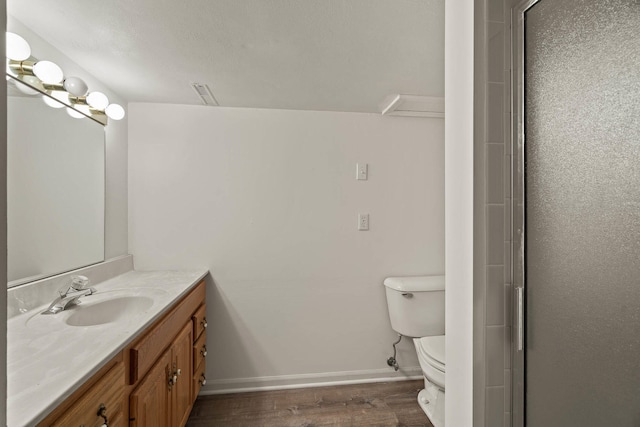 full bathroom with vanity, wood finished floors, toilet, and baseboards