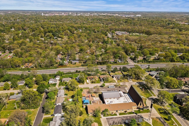 birds eye view of property with a forest view