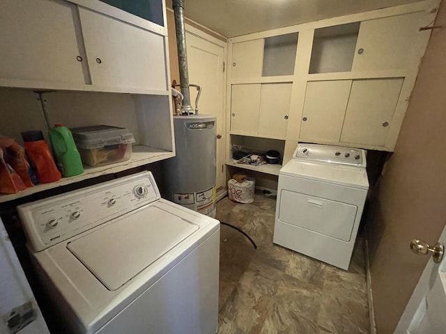 washroom featuring cabinet space, separate washer and dryer, and gas water heater