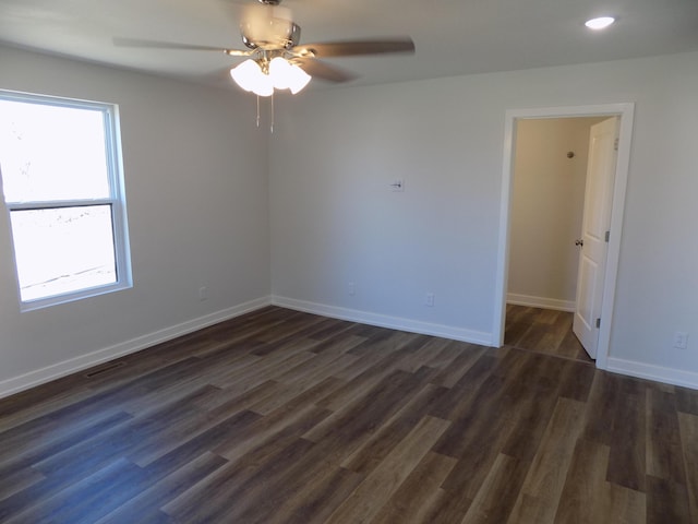 empty room featuring recessed lighting, visible vents, dark wood-type flooring, ceiling fan, and baseboards