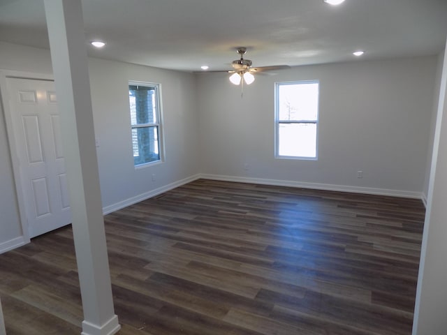 spare room with dark wood-style floors, recessed lighting, baseboards, and a ceiling fan