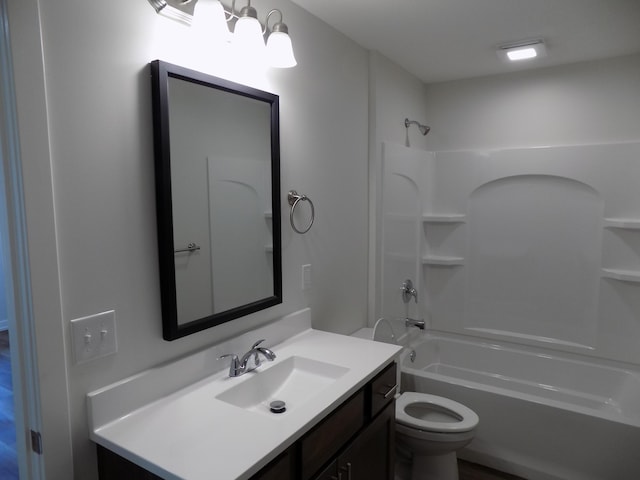 bathroom featuring toilet, bathtub / shower combination, and vanity