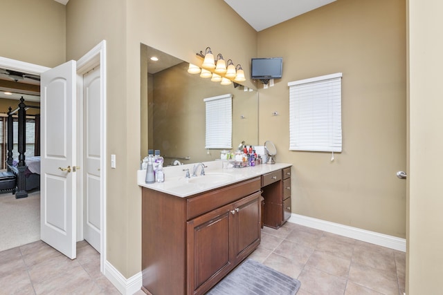 full bathroom with tile patterned floors, baseboards, and vanity