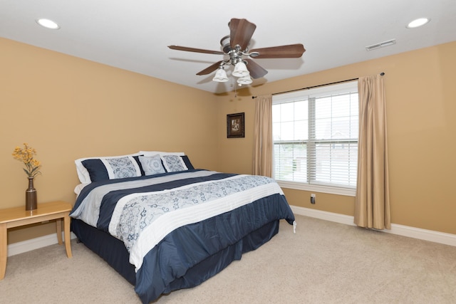 carpeted bedroom with ceiling fan, recessed lighting, visible vents, and baseboards