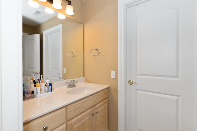 bathroom with visible vents and vanity