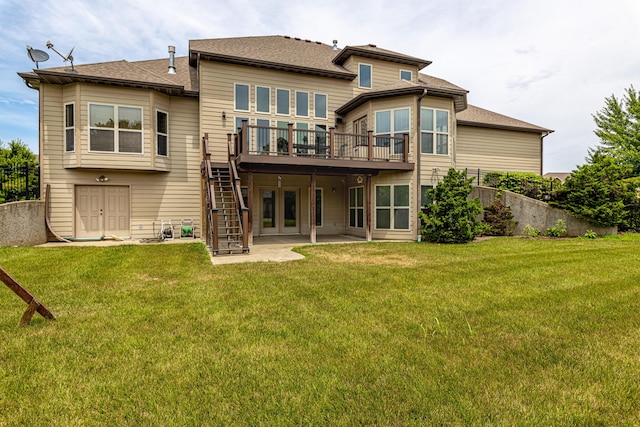 back of property with a patio area, a lawn, fence, and stairs