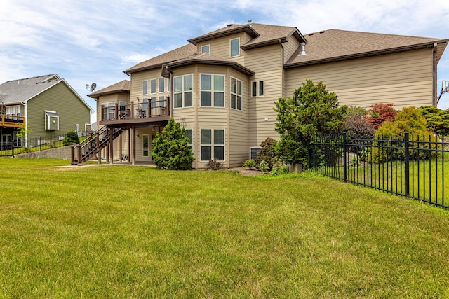 back of property with a lawn, stairway, central AC unit, fence, and a wooden deck