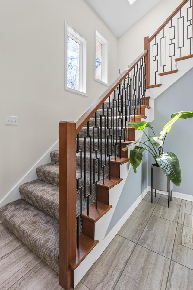 stairway with baseboards