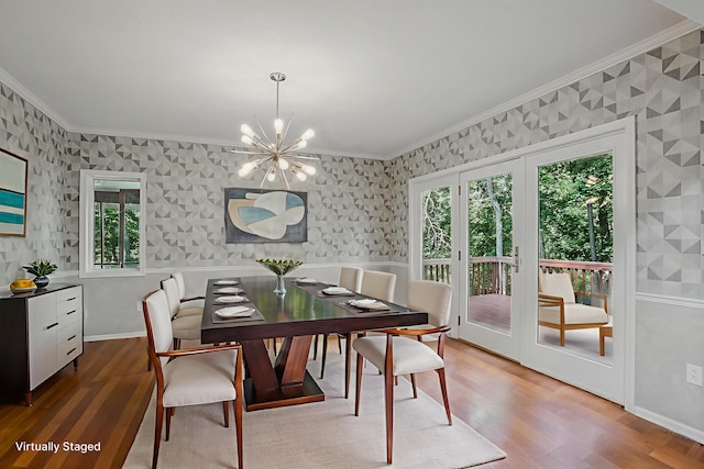 3700 S Joan Ct, Columbia, MO 65201 - dining room with wallpapered walls, ornamental molding, a chandelier, healthy amount of natural light, and wood finished floors