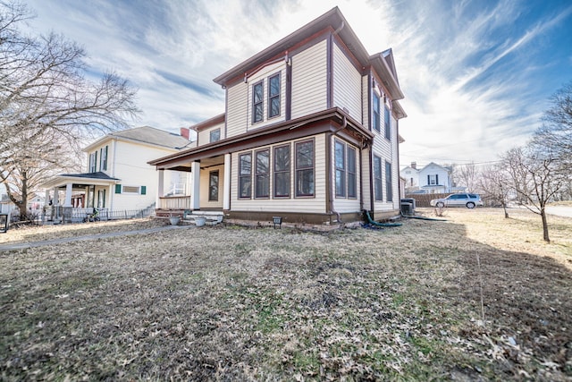 view of front of house with covered porch and central AC