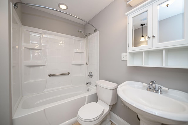 full bathroom featuring bathtub / shower combination, baseboards, a sink, and toilet