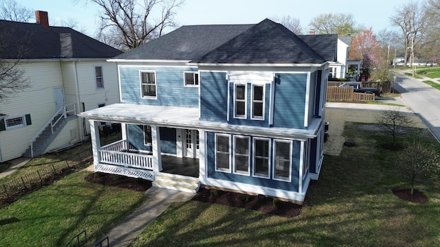 414 N Church, Fayette, MO 65248 - rear view of property with fence, a lawn, a shingled roof, and a porch