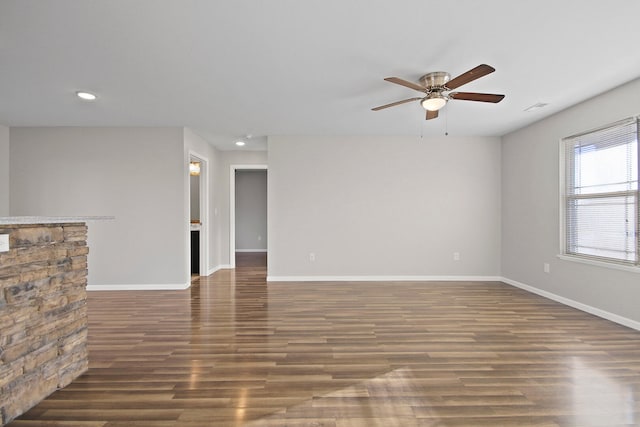 unfurnished living room featuring recessed lighting, ceiling fan, baseboards, and wood finished floors