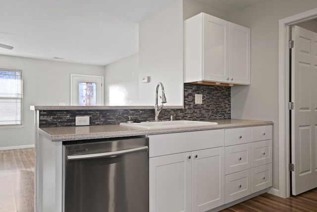 kitchen featuring a sink, a wealth of natural light, white cabinetry, and dishwasher