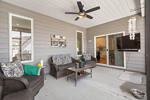 exterior space with wood ceiling and a ceiling fan