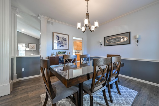 dining space featuring dark wood-style floors, ornamental molding, and a notable chandelier