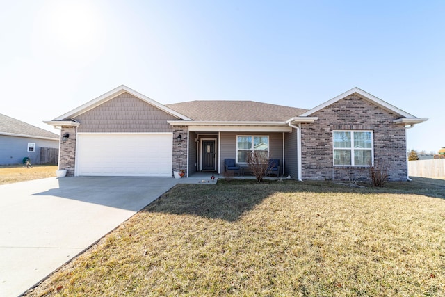 single story home featuring a front yard, brick siding, driveway, and an attached garage