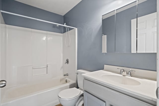 bathroom featuring toilet, vanity, and shower / bathtub combination