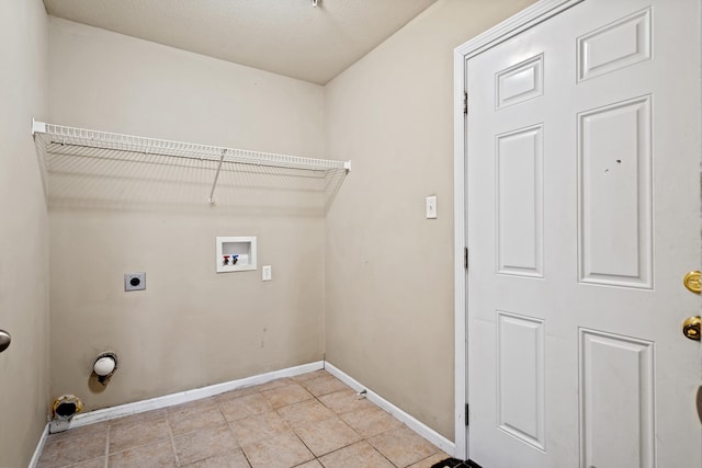 laundry room featuring light tile patterned floors, hookup for a washing machine, hookup for an electric dryer, laundry area, and baseboards