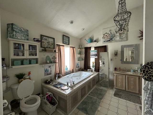 bathroom featuring lofted ceiling, toilet, vanity, a walk in shower, and a whirlpool tub