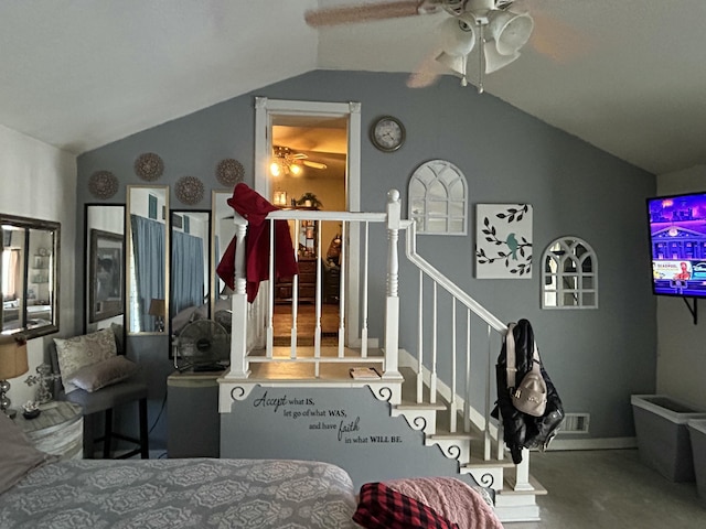 bedroom with vaulted ceiling, visible vents, and a ceiling fan