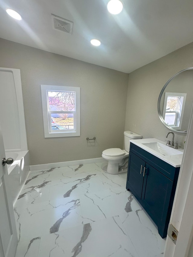 bathroom featuring baseboards, visible vents, toilet, marble finish floor, and vanity