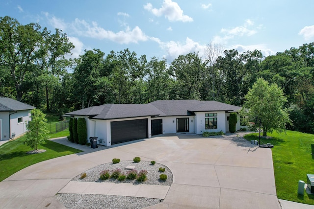 ranch-style home with an attached garage, fence, driveway, stucco siding, and a front lawn