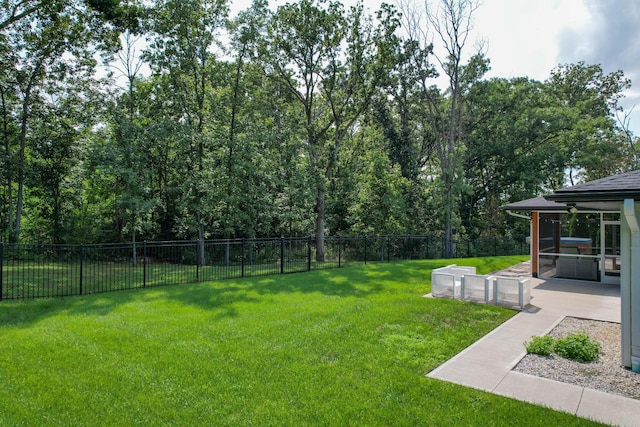 view of yard with a fenced backyard and a patio