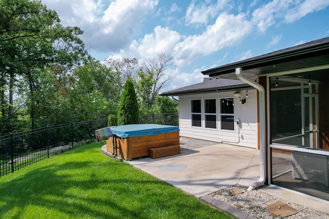 view of yard featuring a patio area, a fenced backyard, and a hot tub